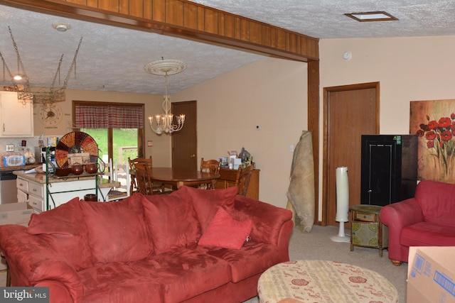 carpeted living room with a textured ceiling and a chandelier