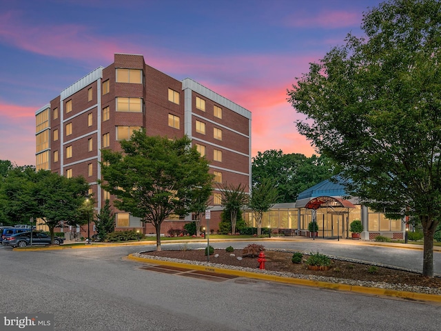 view of outdoor building at dusk