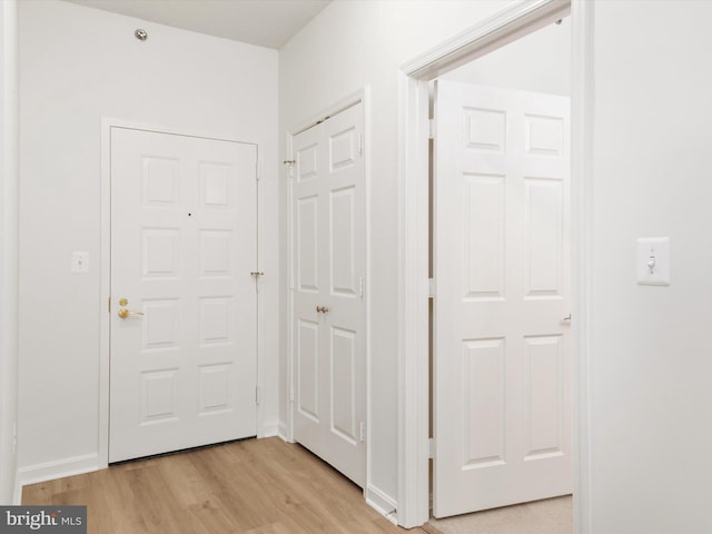 hall with light wood-type flooring