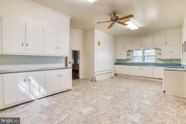 kitchen featuring white cabinetry, light tile patterned floors, and ceiling fan