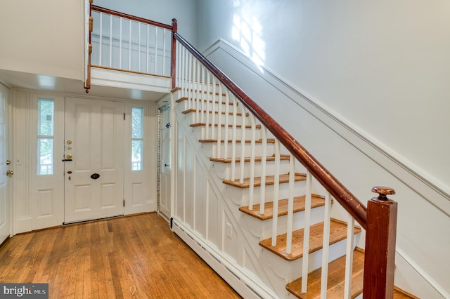 foyer featuring a baseboard radiator and light wood-type flooring