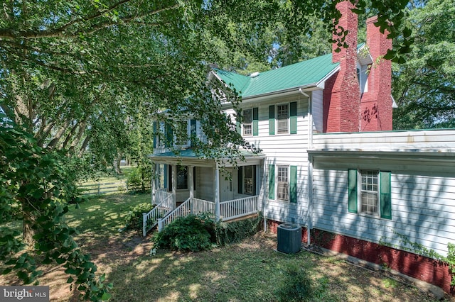 view of front of house featuring central air condition unit and covered porch