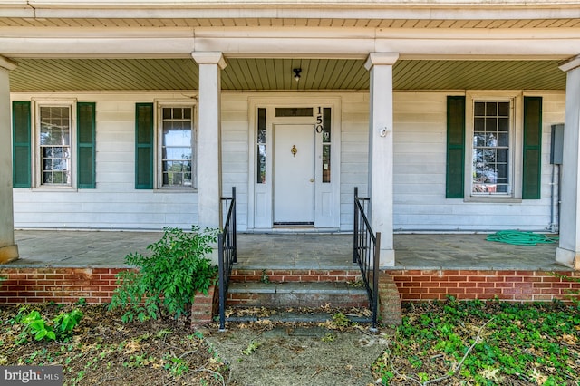 entrance to property with covered porch