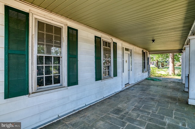 view of patio featuring a porch