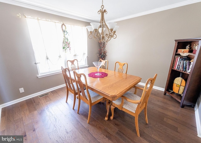 dining area featuring a notable chandelier, crown molding, and dark wood-type flooring