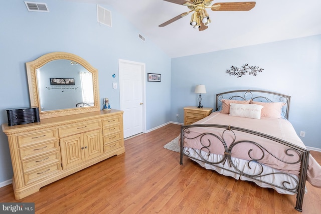 bedroom with light hardwood / wood-style floors, ceiling fan, and lofted ceiling