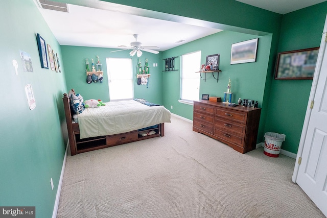 bedroom with ceiling fan and light colored carpet