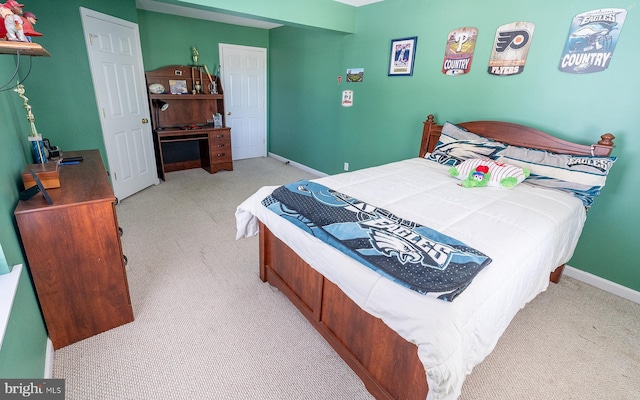 bedroom with light colored carpet