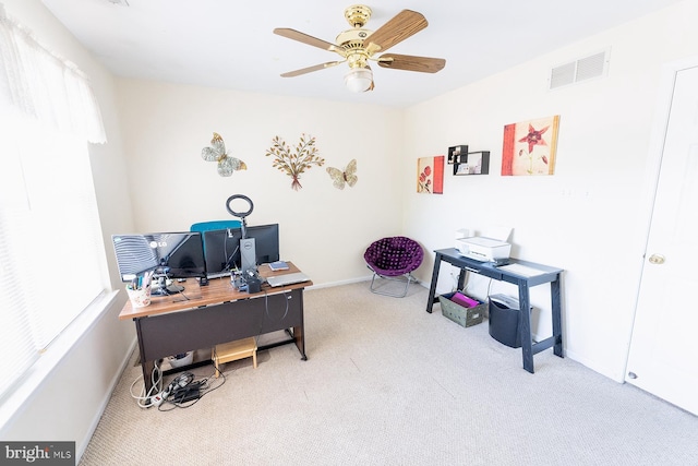 carpeted home office with ceiling fan