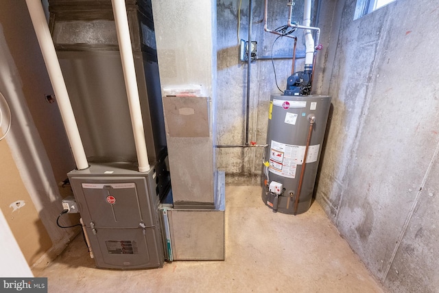 utility room with heating unit and gas water heater