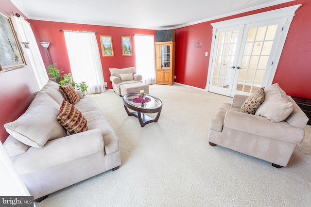 carpeted living room with ornamental molding and french doors