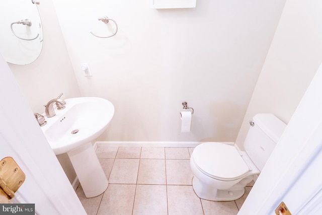 bathroom with sink, tile patterned flooring, and toilet