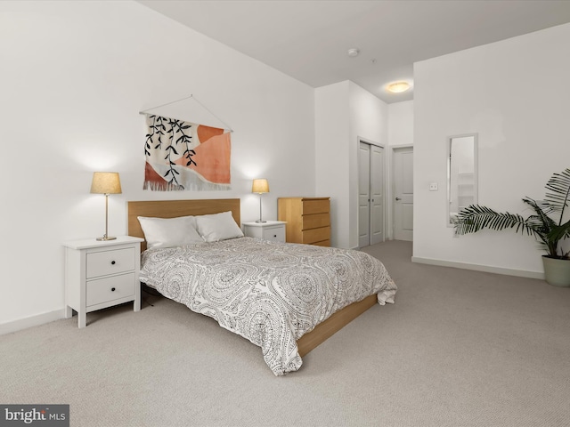 carpeted bedroom featuring a closet