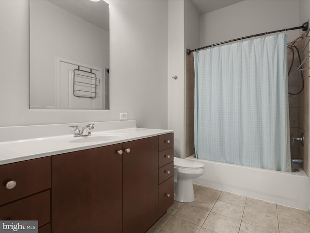 full bathroom featuring tile patterned floors, vanity, toilet, and shower / bathtub combination with curtain