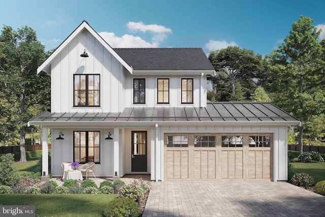 modern farmhouse with covered porch, a garage, and a front lawn