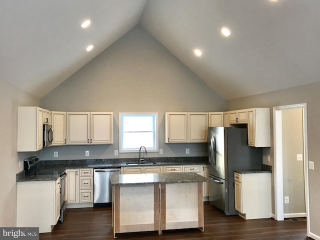 kitchen with a kitchen island, sink, stainless steel appliances, and high vaulted ceiling