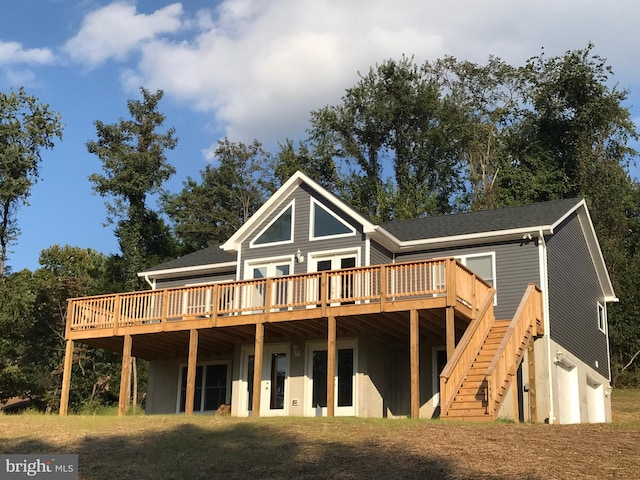 back of house with a deck