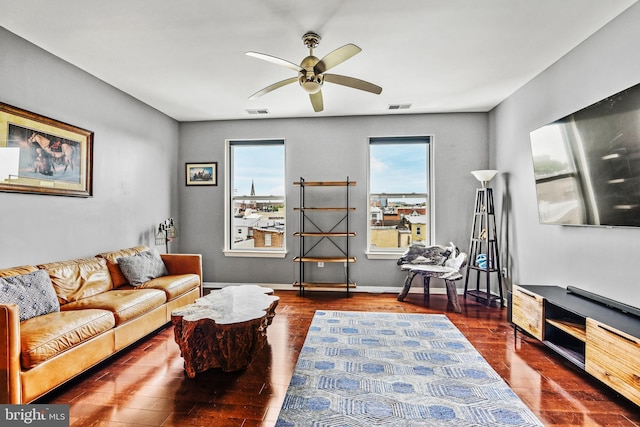 living room with dark hardwood / wood-style floors and ceiling fan