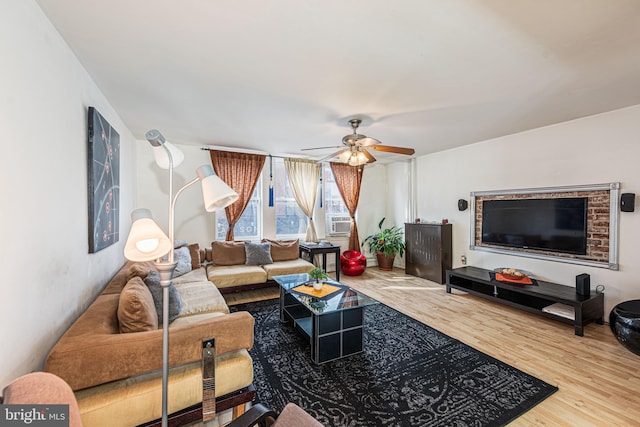 living room with ceiling fan and light hardwood / wood-style floors