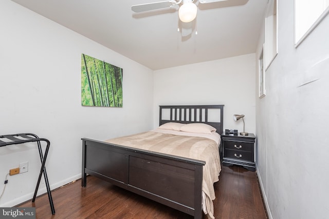 bedroom featuring ceiling fan and dark hardwood / wood-style flooring