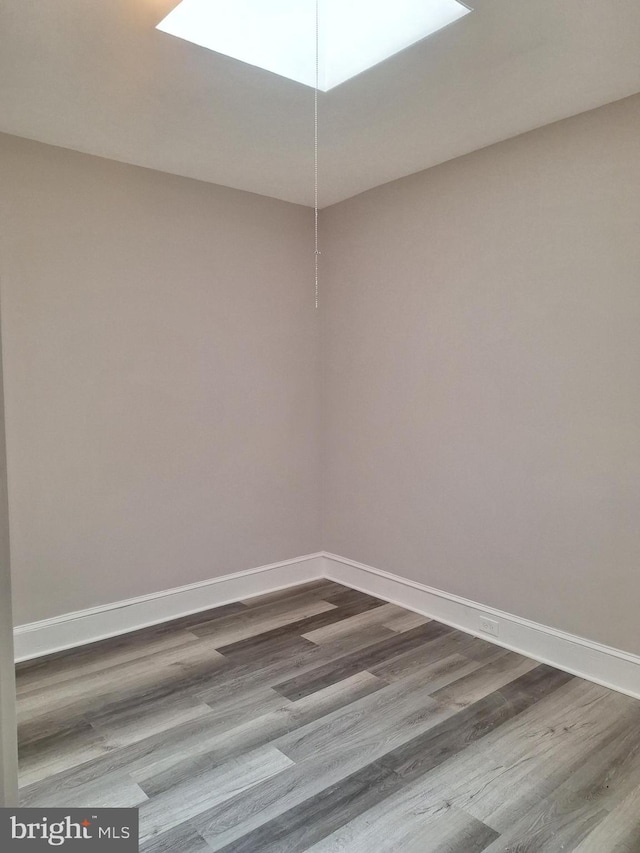 spare room featuring hardwood / wood-style floors