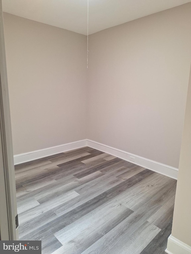 empty room featuring wood-type flooring