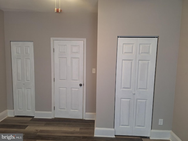 bedroom featuring dark hardwood / wood-style flooring and a closet