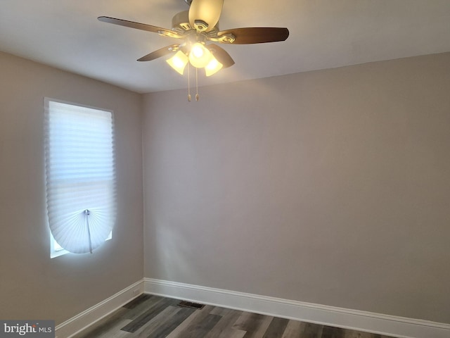 unfurnished room featuring dark wood-type flooring