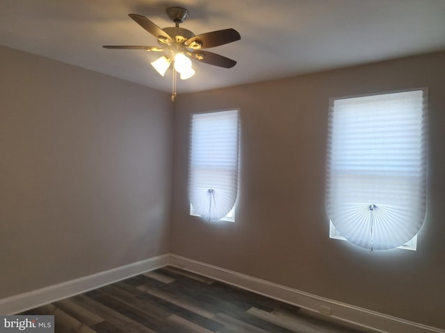 unfurnished room featuring dark hardwood / wood-style flooring and ceiling fan