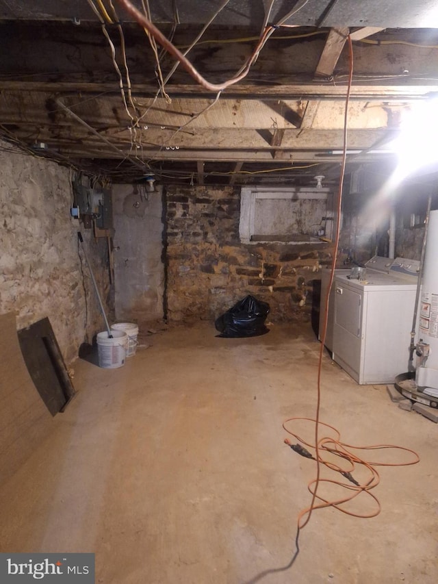 basement featuring independent washer and dryer and gas water heater