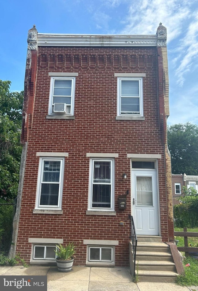 view of front facade with cooling unit