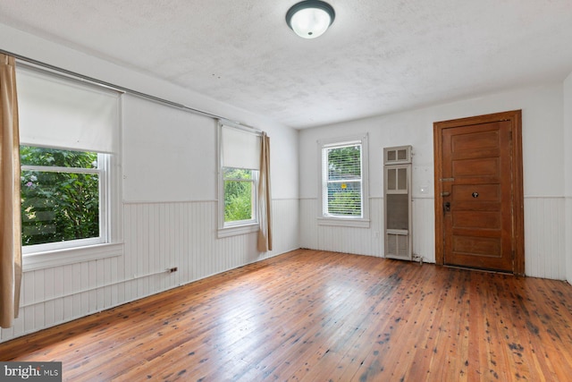 unfurnished room featuring hardwood / wood-style floors