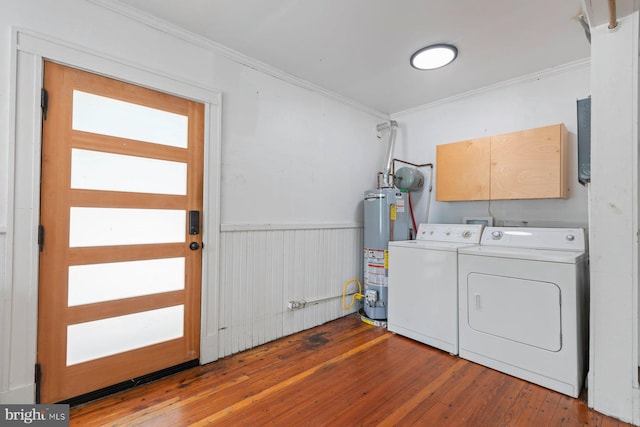 clothes washing area featuring cabinets, gas water heater, independent washer and dryer, ornamental molding, and dark hardwood / wood-style flooring