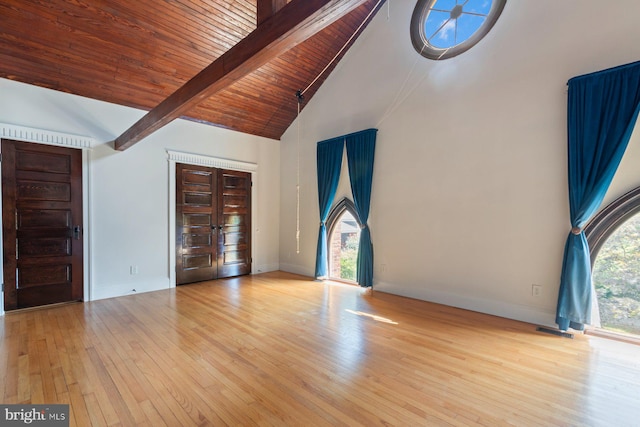 interior space featuring beam ceiling, wooden ceiling, high vaulted ceiling, and light hardwood / wood-style flooring