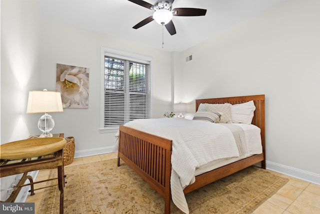 bedroom featuring ceiling fan and light tile patterned flooring