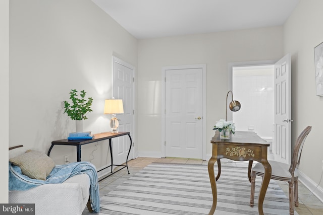 sitting room with light tile patterned floors