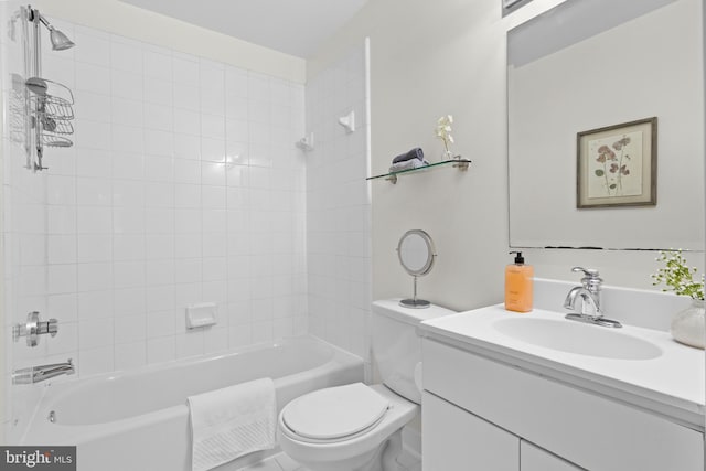 full bathroom with toilet, vanity, and tiled shower / bath combo