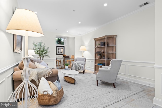 living room featuring crown molding and light tile patterned flooring