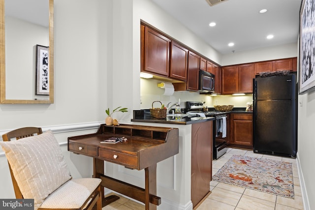 kitchen with black appliances and light tile patterned floors