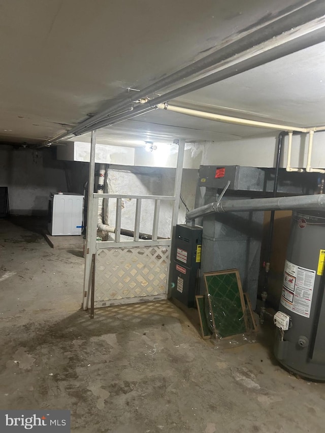 basement with gas water heater and washer / clothes dryer