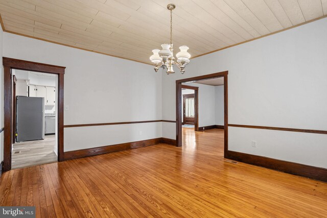 75 Church St, Beverly, NJ 08010 - unfurnished room featuring hardwood / wood-style floors, ornamental molding, wood ceiling, and an inviting chandelier