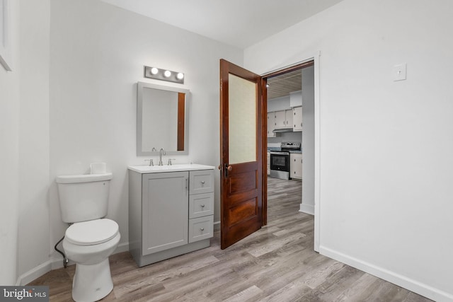 75 Church St, Beverly, NJ 08010 - bathroom featuring toilet, hardwood / wood-style flooring, and vanity