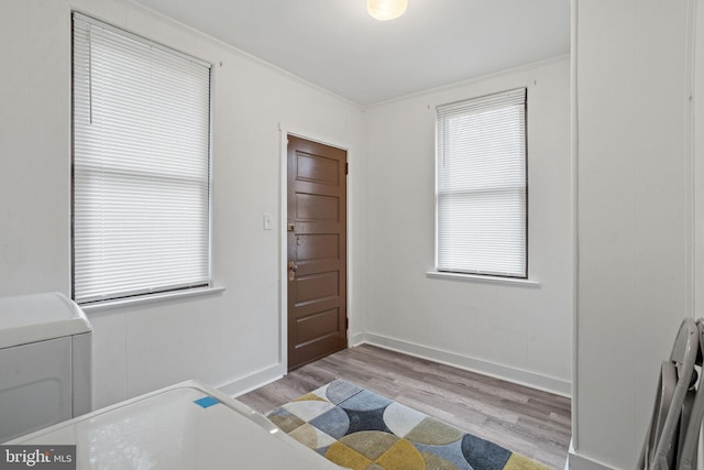 75 Church St, Beverly, NJ 08010 - entryway featuring light wood-type flooring and crown molding