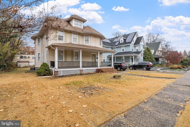 view of front of property featuring covered porch