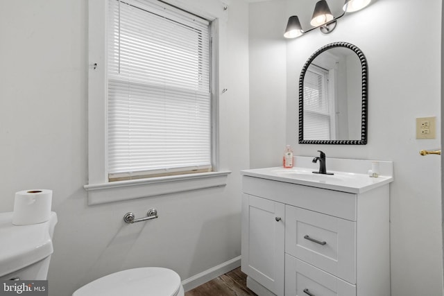 75 Church St, Beverly, NJ 08010 - bathroom with toilet, vanity, and hardwood / wood-style flooring