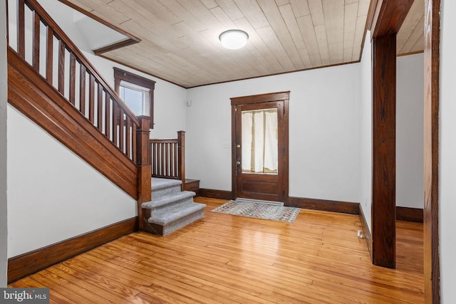 75 Church St, Beverly, NJ 08010 - entrance foyer with light hardwood / wood-style flooring, ornamental molding, and wooden ceiling