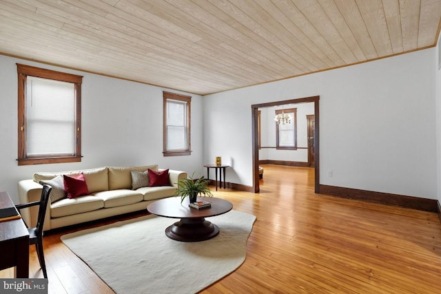 75 Church St, Beverly, NJ 08010 - living room featuring light wood-type flooring, wood ceiling, and a notable chandelier
