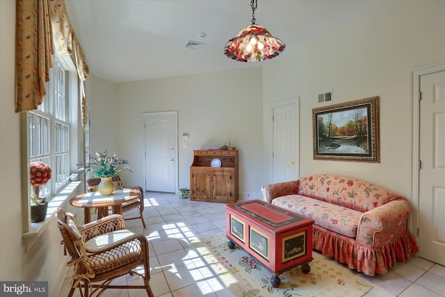 tiled living room with a healthy amount of sunlight