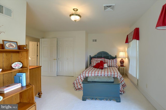 carpeted bedroom with a closet