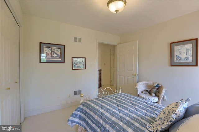 bedroom with carpet and a closet